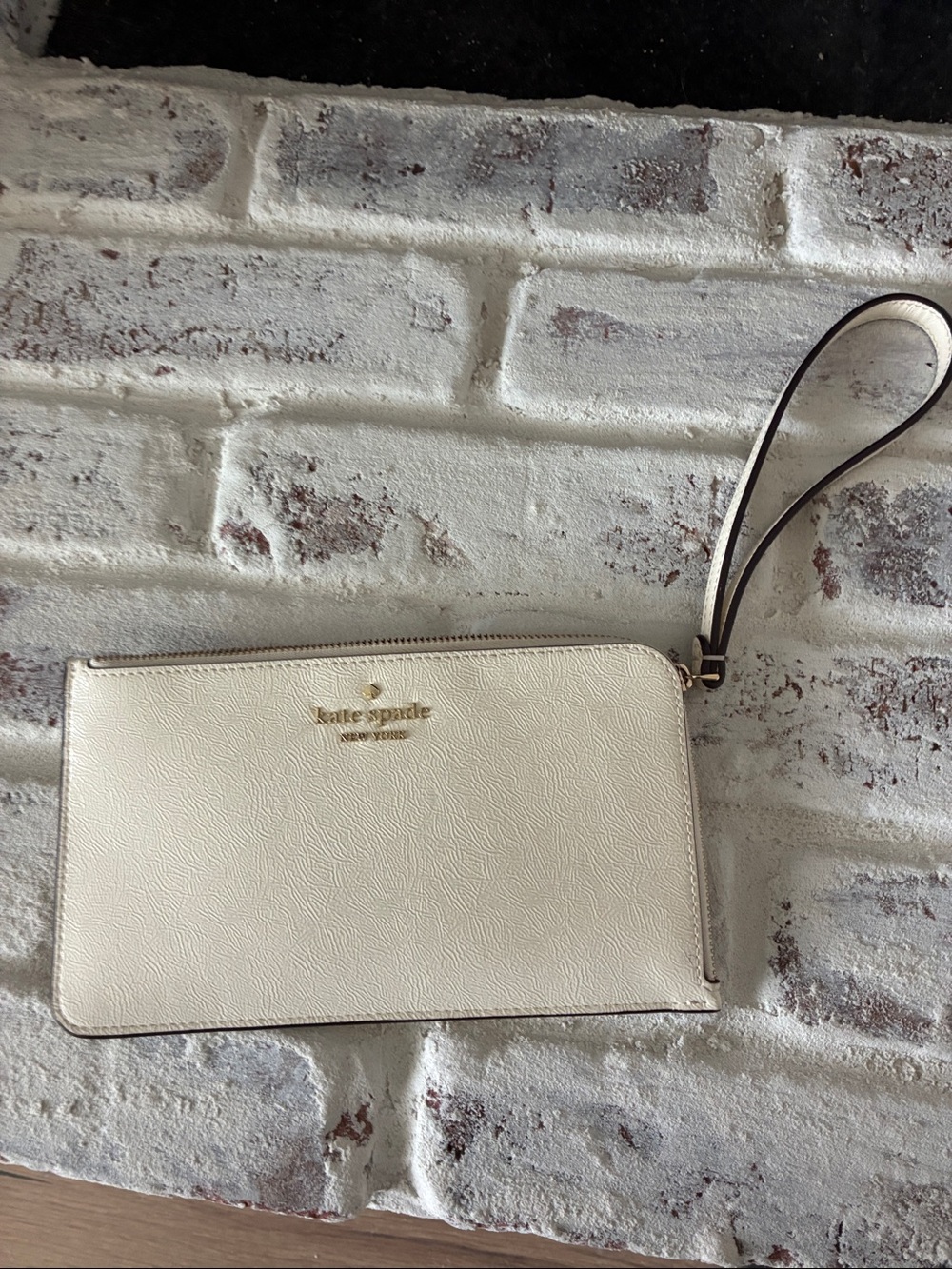 kate spade Cream Leather Zip Wristlet with Gold Logo